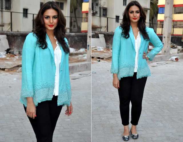 Black pants topped off with an aqua top, a bold red lip and interesting shoes.