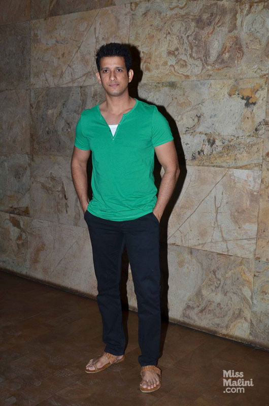 Sharman Joshi in tones of green and navy, set off by sepia sandals